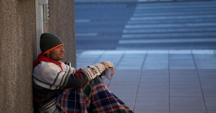 1280px-Beggar_in_Uppsala,_Sweden